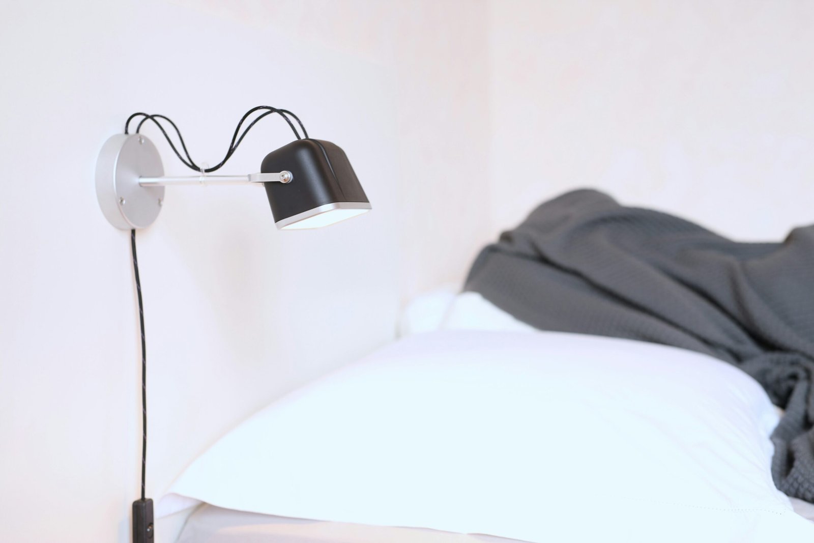Bedside setup with soft lighting for LectroFan Evo white noise machine review
