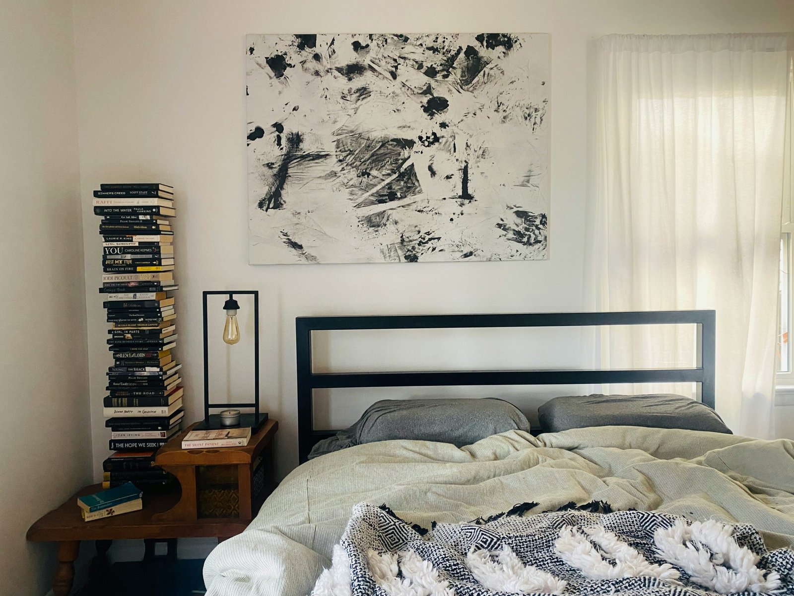 Soft weighted blanket folded on a neutral bed in a calm bedroom, ideal for better sleep