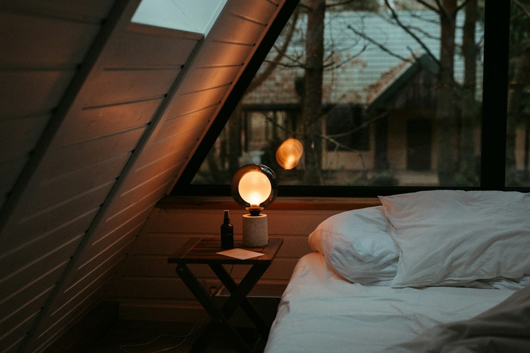 Simple calm bedroom with bed and soft natural light
