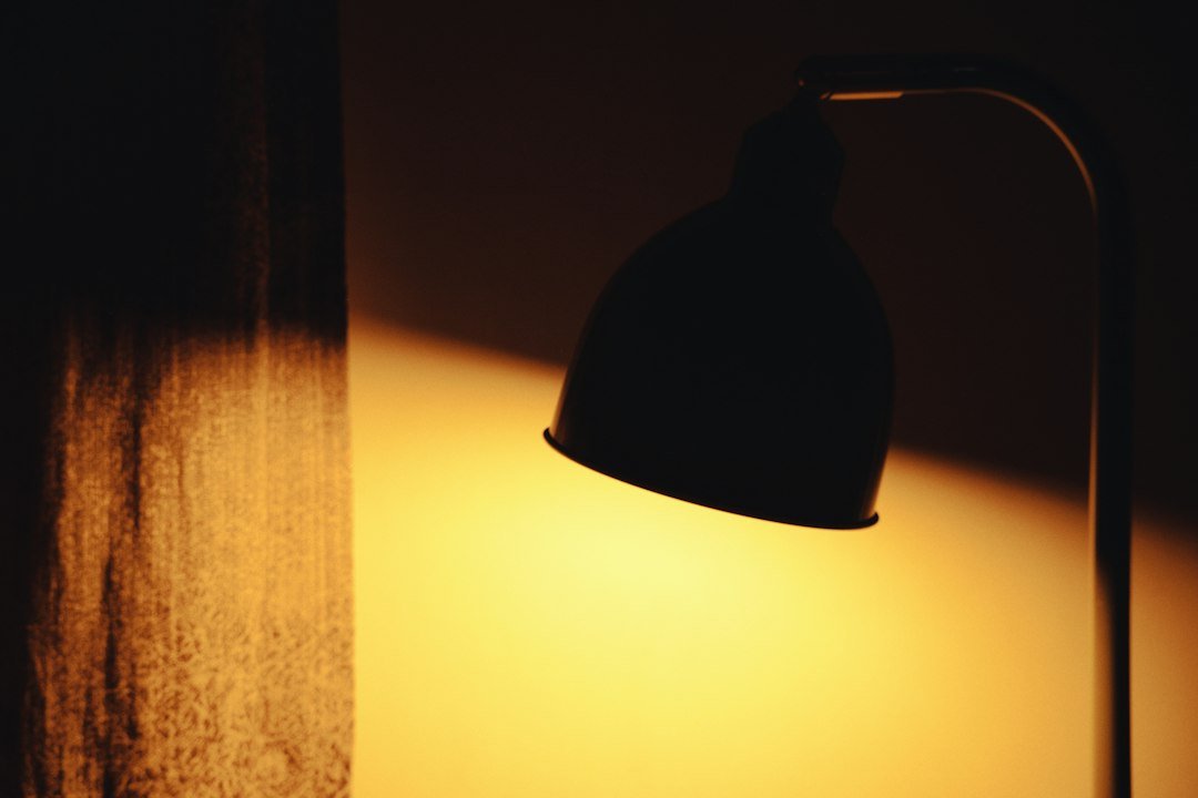 Warm ambient lamp light creating a cozy bedroom atmosphere